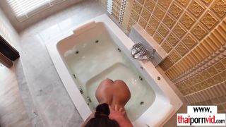 Tiny titted amateur Thai teen Cherry fucking a big white cock in the bath