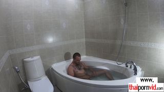 Petite amateur Thai teen Cherry waxing her BFs big white cock in the bath